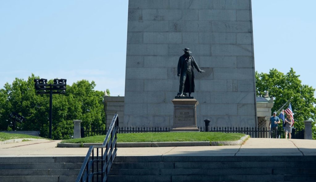 Colonel William Prescott Statue and the Bunker Hill Monument in Boston,